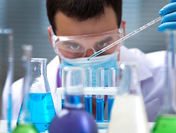 scientist mixing chemicals blog
